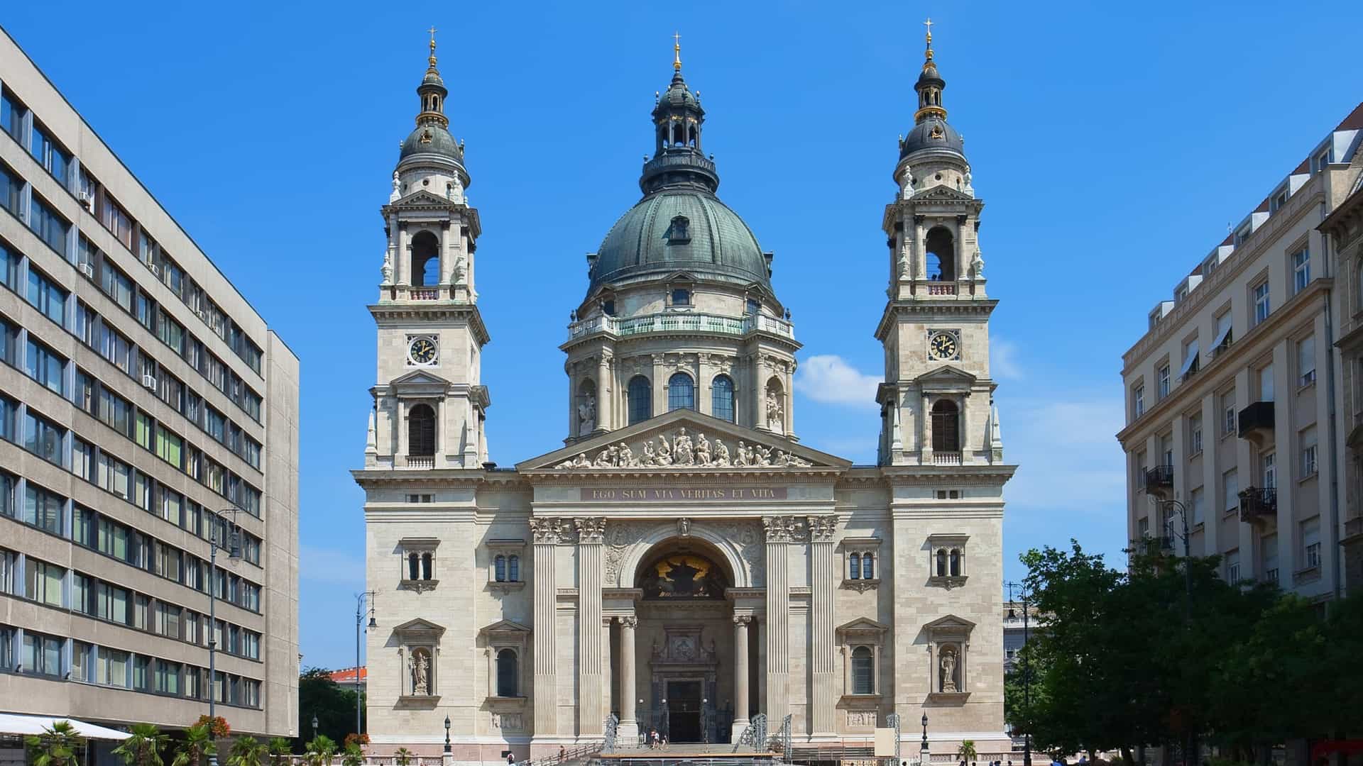 A photo of St. Stephen's Basilica in Budapest, Hungary. The neoclassical and neo Renaissance style church features a large central dome and two bell towers.