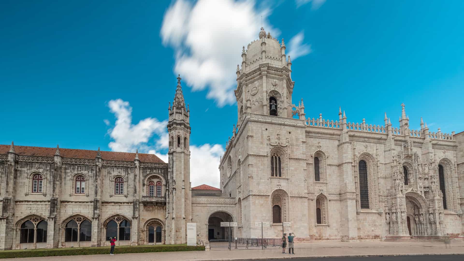 The Jerónimos Monastery, a magnificent UNESCO World Heritage site in the Belém district of Lisbon, Portugal. The image shows the monastery's intricate stone facade, a stunning example of late Portuguese Gothic, or Manueline, architecture.