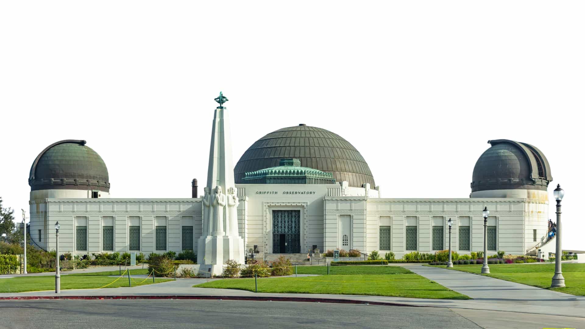 The Griffith Observatory in Los Angeles, California, is shown in a professional studio photograph, isolated on a white background. The Art Deco style building with its central dome and two side domes is clearly visible. The image focuses solely on the architecture of the famous landmark, without any surrounding landscape or cityscape.