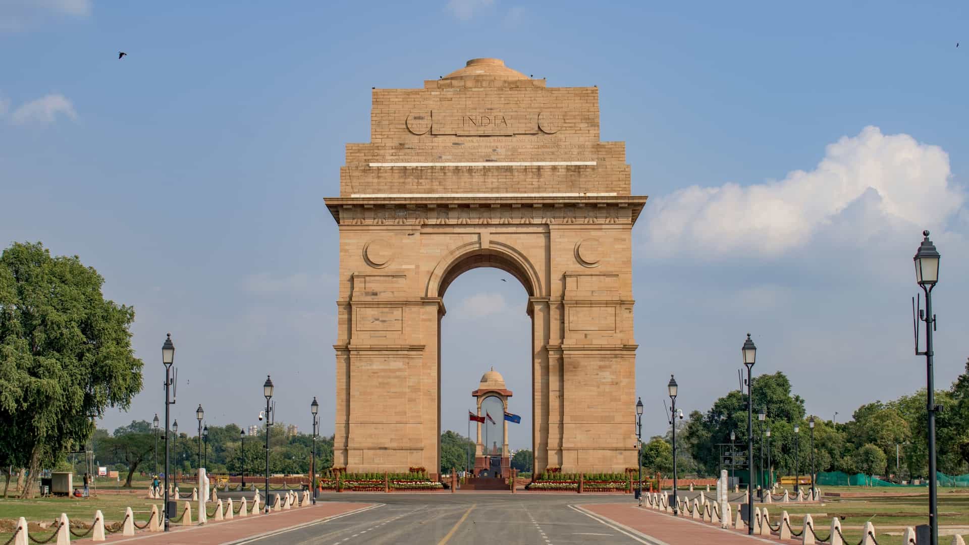 A view of the India Gate in New Delhi, India. The image shows the monumental 42 meter high archway, a war memorial dedicated to the soldiers of the British Indian Army who died in World War I and other conflicts. The structure is made of sandstone and stands as a central landmark in the city.