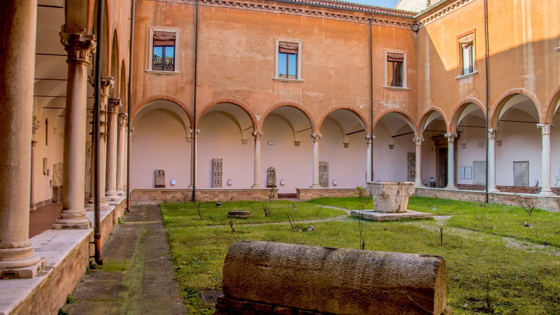 A view of the exterior of the National Museum of Ravenna, which is situated in the majestic complex of the former Benedictine Monastery of San Vitale in Ravenna, Italy. The museum, which is housed in the monastery's cloisters and buildings adjacent to the famous Basilica of San Vitale, contains a wide collection of archaeological finds, sculptures, ivory carvings, icons, Renaissance bronzes, and fourteenth-century frescoes.