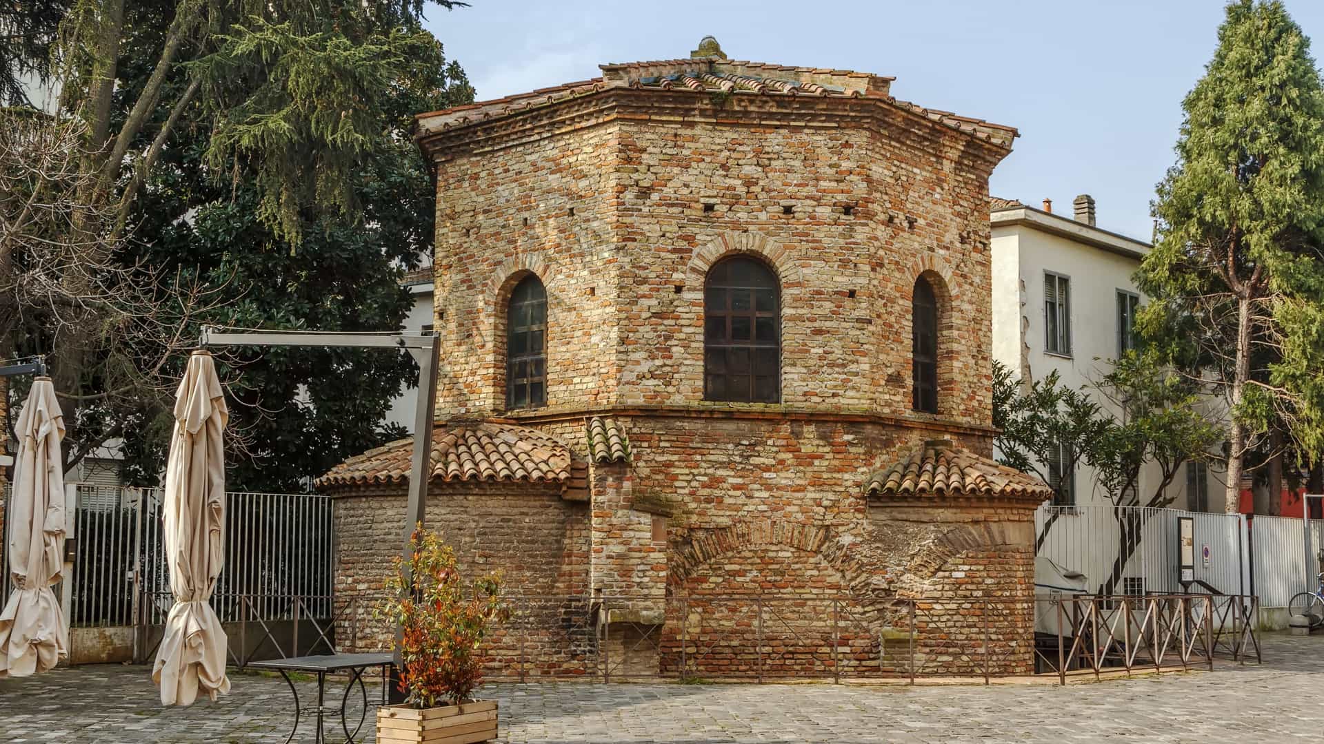 Exterior view of the Arian Baptistry in Ravenna, Italy, a simple, ancient octagonal brick structure erected by Theodoric the Great in the late 5th or early 6th century.