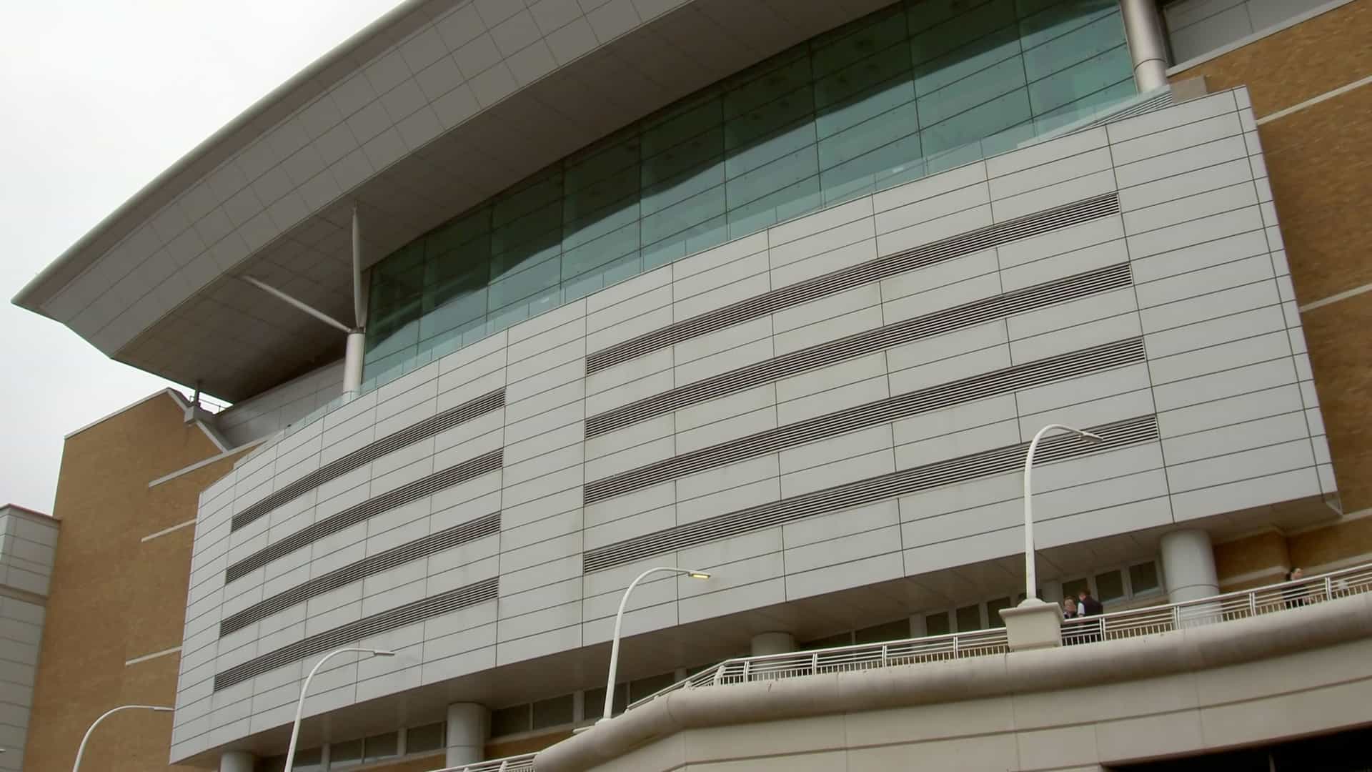 A photograph capturing an architectural detail or close up section of the modern Westquay Shopping Mall in Southampton, UK. The image highlights a specific feature of the building's contemporary design, such as its glazed facade, steel framework, or exterior cladding.