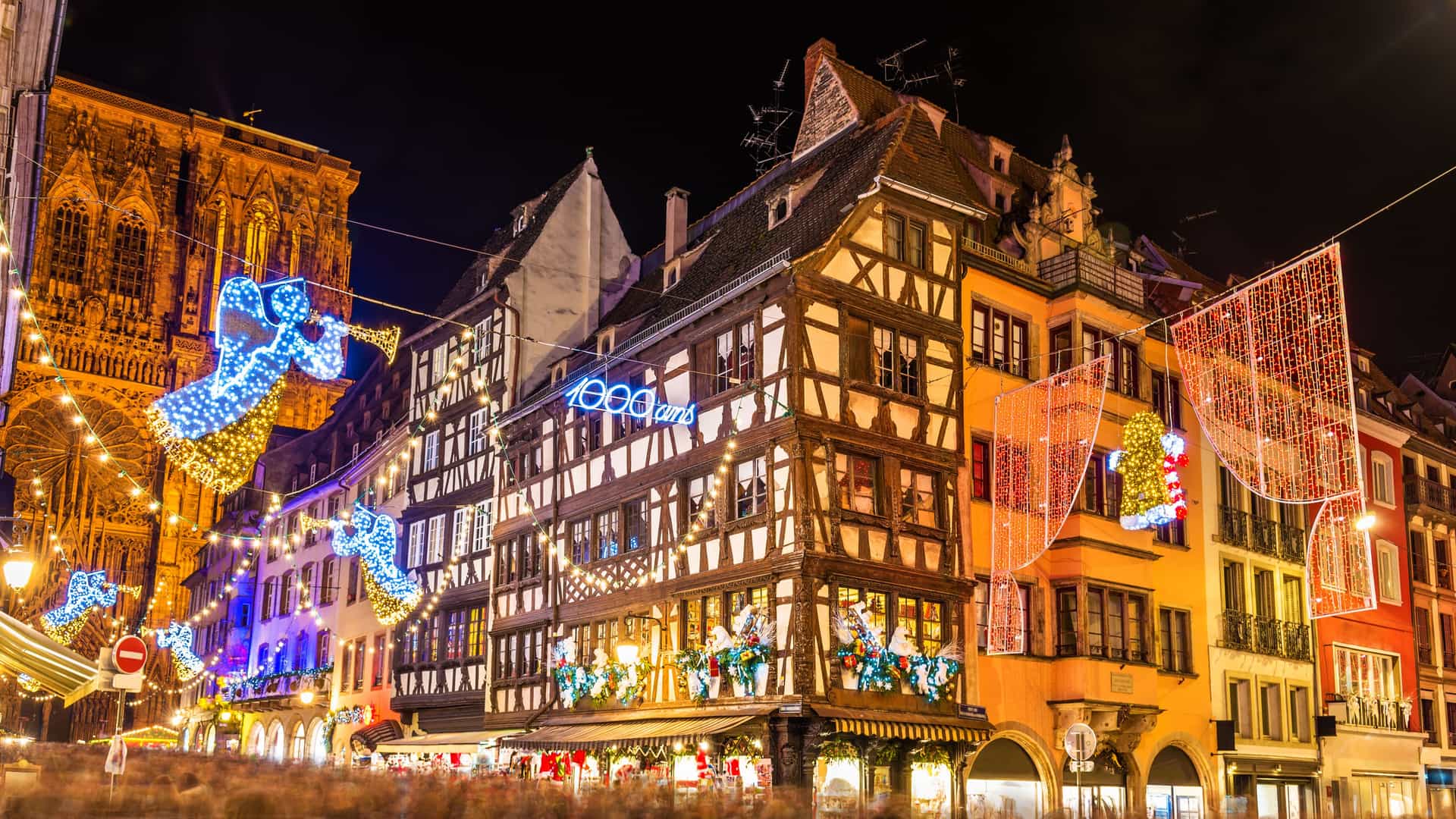 A brightly decorated street corner during a Christmas Market in Strasbourg, France.