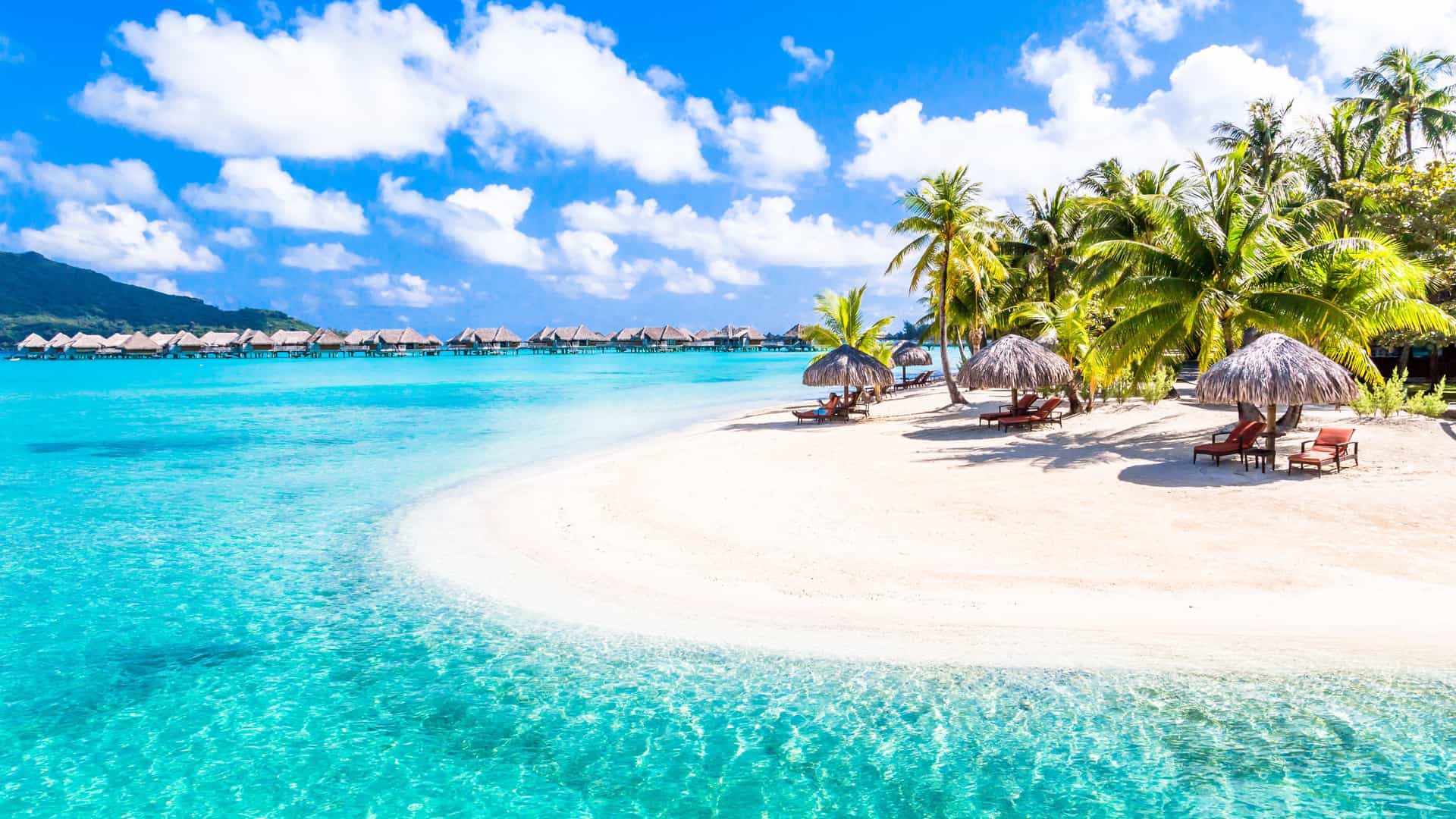 Turquoise lagoon and overwater bungalows in Bora Bora, French Polynesia—captured during a Holland America South Pacific cruise escape.