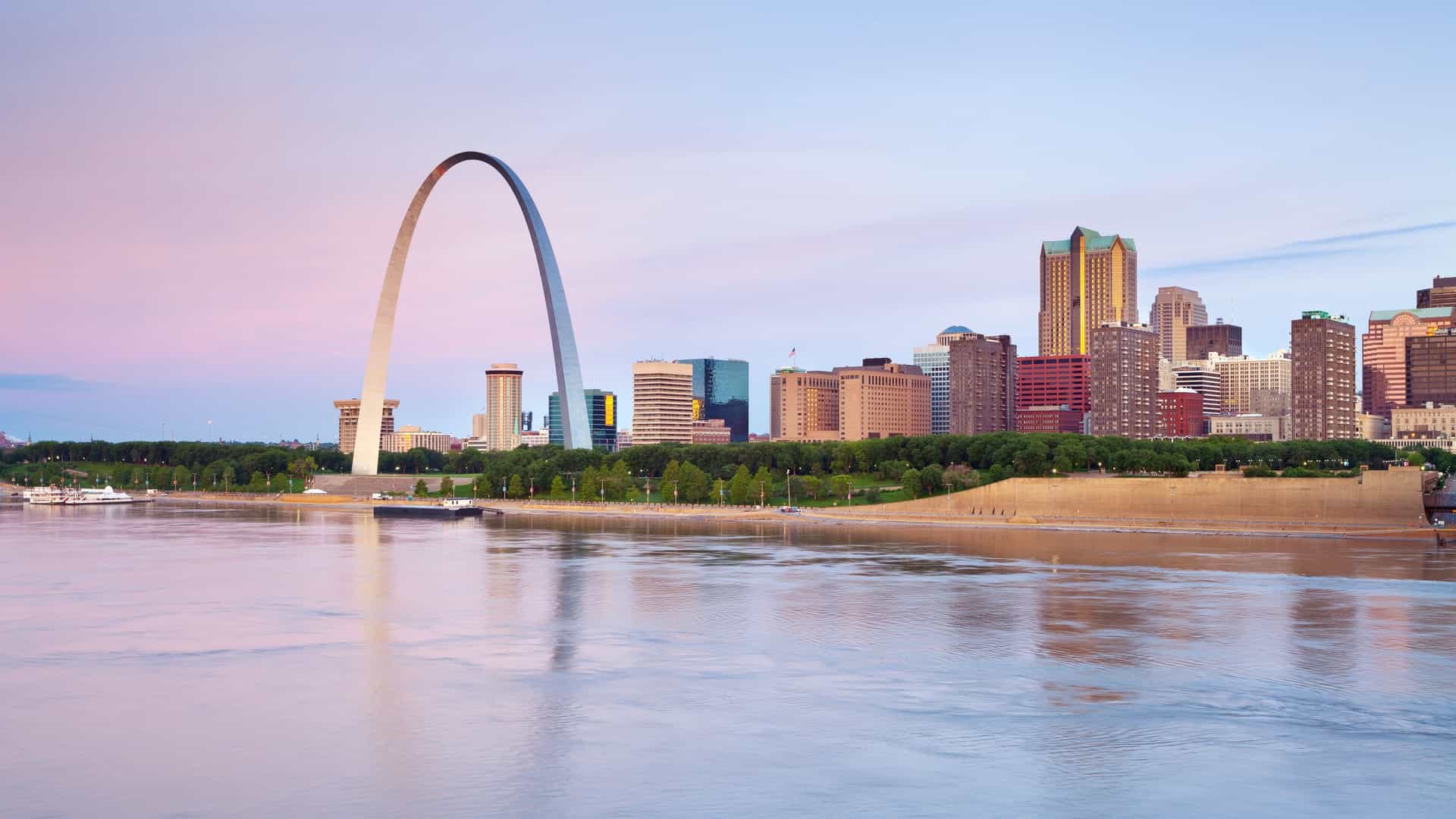 A view of the Mississippi River with the Saint Louis Arch in the background.