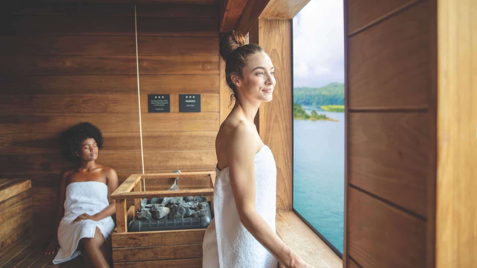 Two women enjoying the sauna in th Mandra Spa.