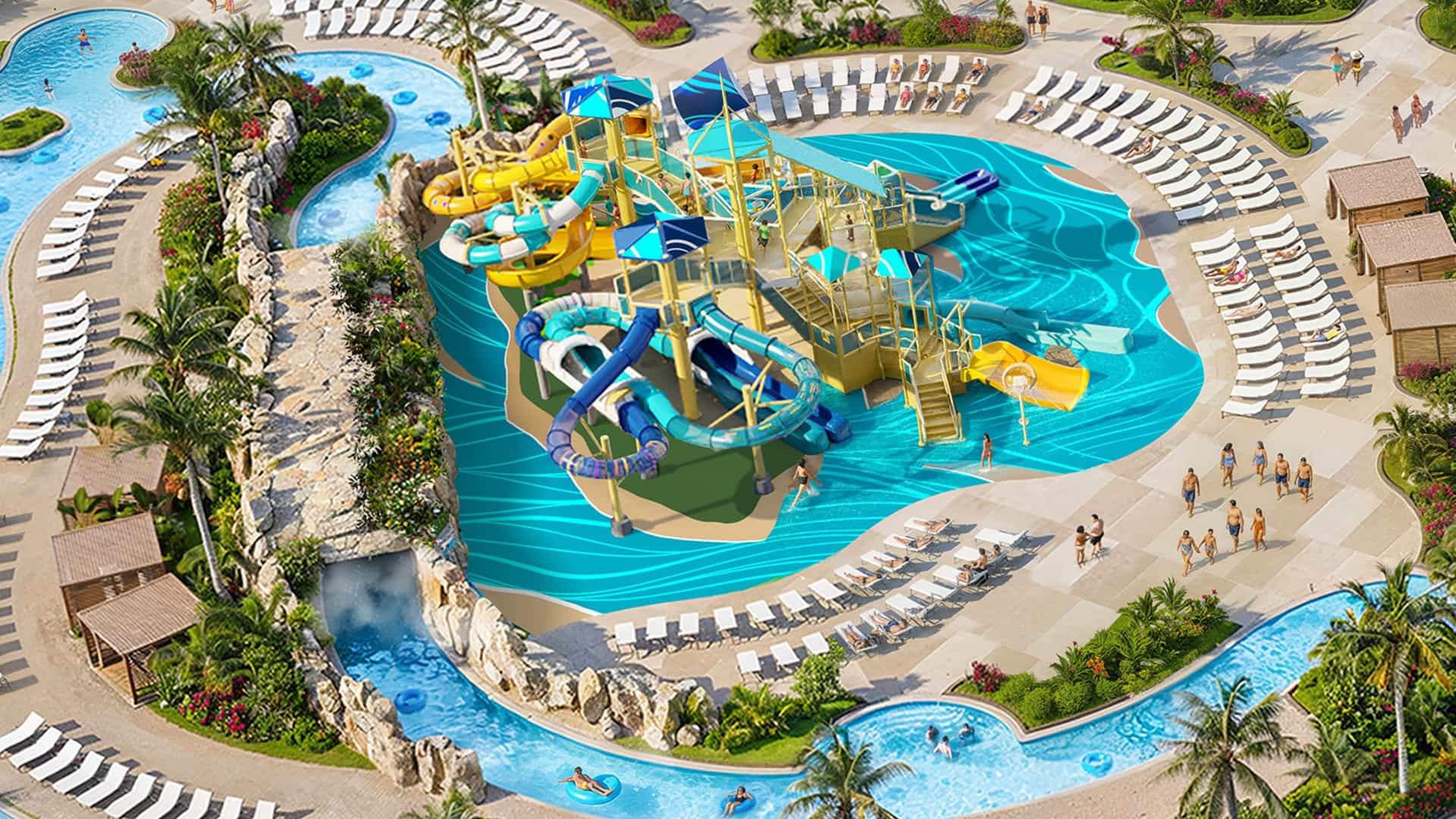 An overhead view of a colorful multi-level splash pad and water play structure at Great Stirrup Cay, surrounded by an active lazy river with people floating in inner tubes, rows of lounge chairs, and private cabanas.