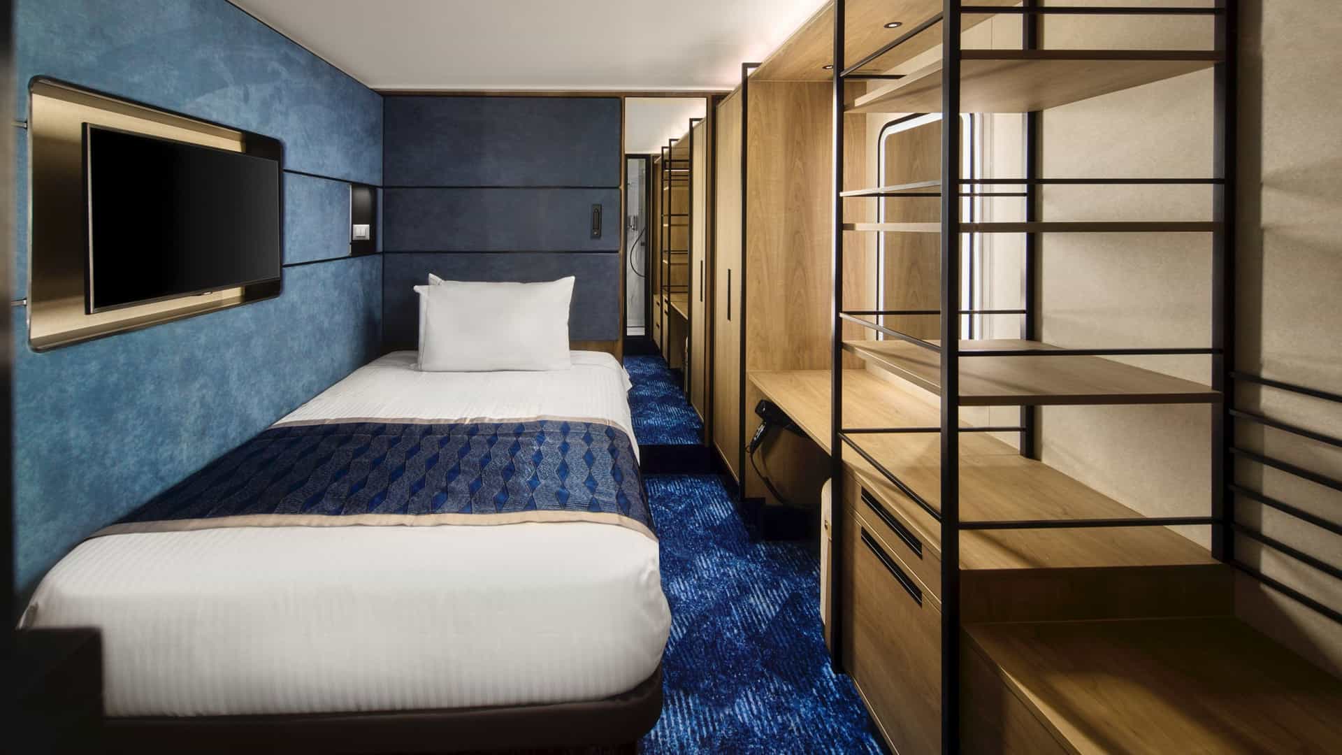 Wide shot of a T1 solo studio room aboard the NCL Prima.