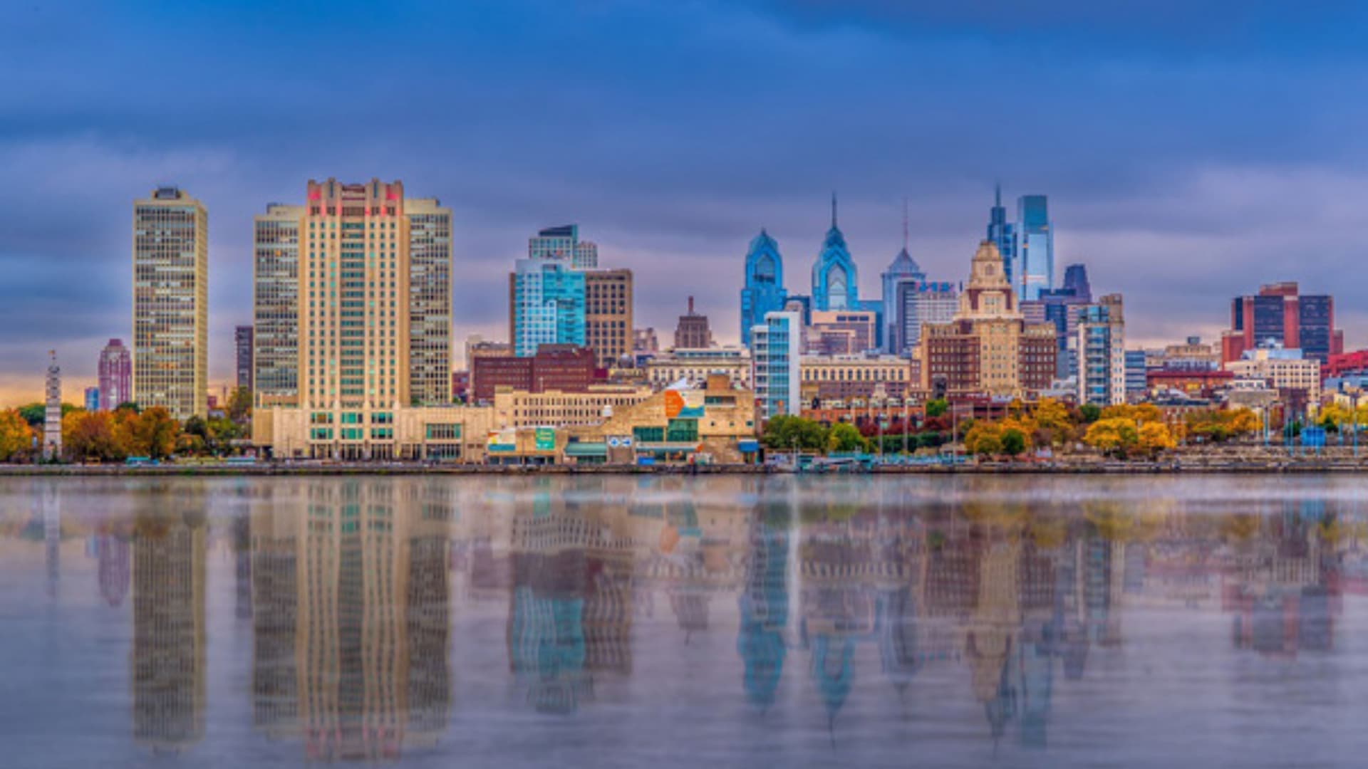 Vibrant Philadelphia cityscape reflection on Delaware River.