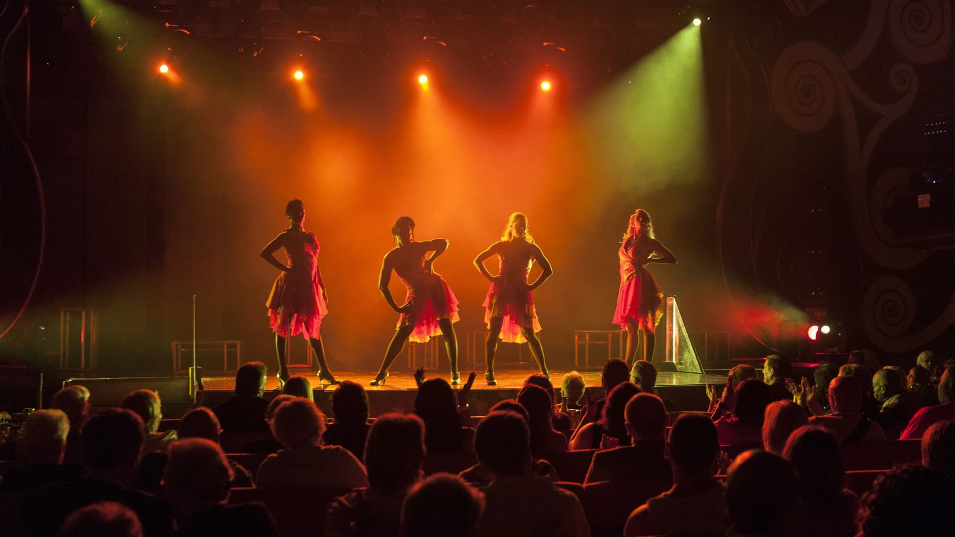 4 actors performing a musical during a Carnival cruise.