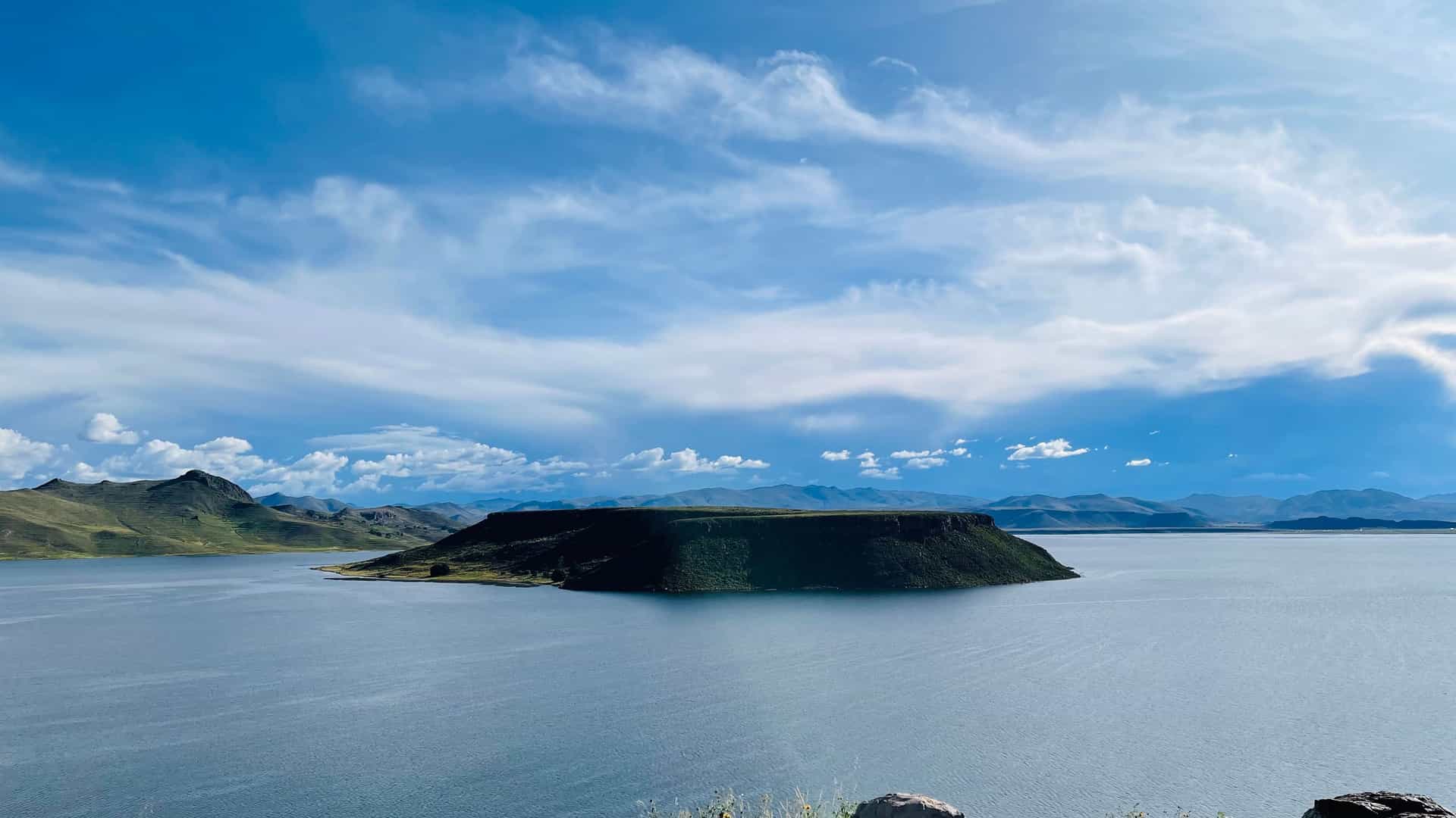 "A stunning wide shot of the volcanic island of Inka T'aqana, or ""Inca's staircase"", in the center of Lake Titicaca near Juliaca, Peru. "