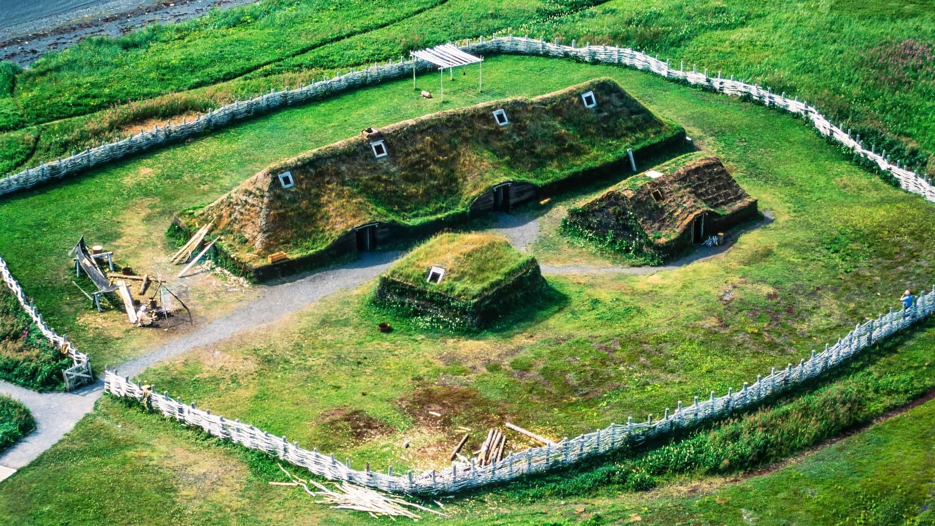 An aerial view of the reconstructed Viking sod houses and longhouses at L'Anse aux Meadows National Historic Site, a UNESCO World Heritage Site in Newfoundland, Canada.