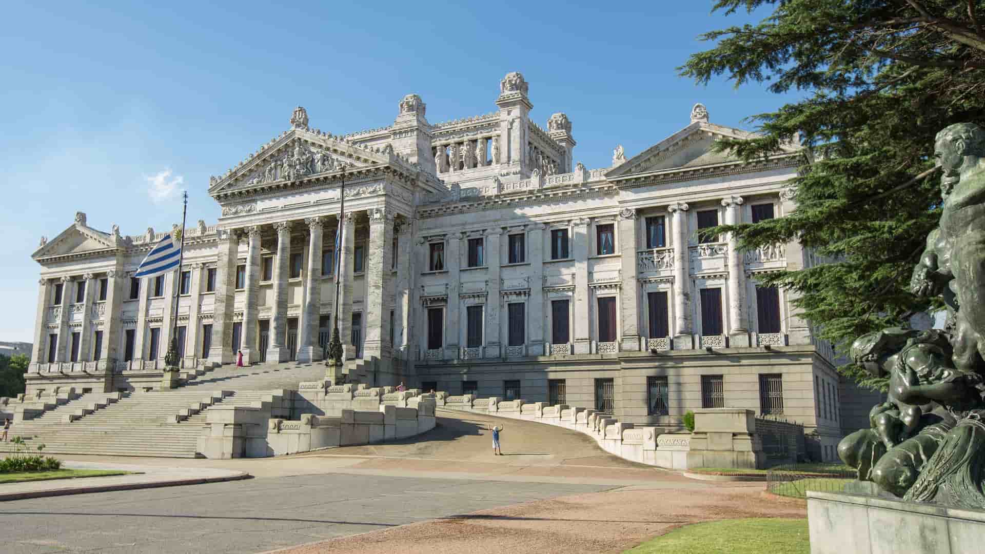 A beautiful frontal shot of the Uruguayan Legislative Palace, or Palacio Legislativo, in Montevideo, with its grand neoclassical architecture, majestic columns, and wide stone staircase.