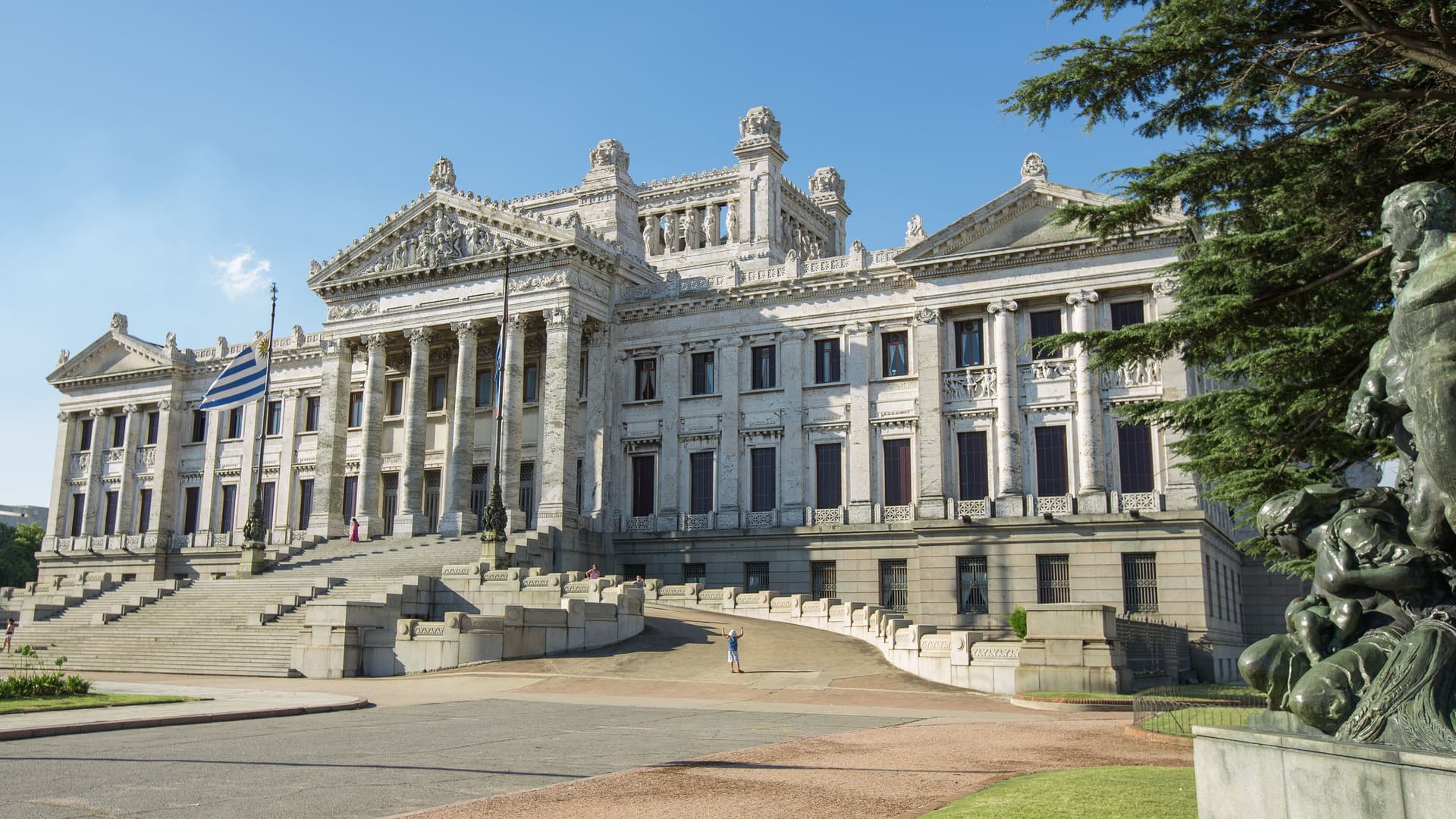 A beautiful frontal shot of the Uruguayan Legislative Palace, or Palacio Legislativo, in Montevideo, with its grand neoclassical architecture, majestic columns, and wide stone staircase.