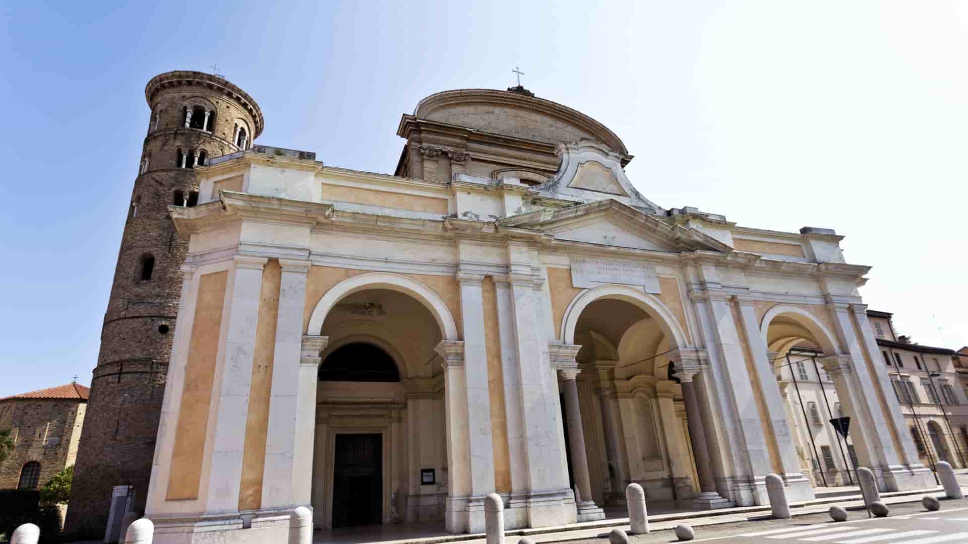 Ravenna Cathedral exterior with arches, dome, and bell tower.