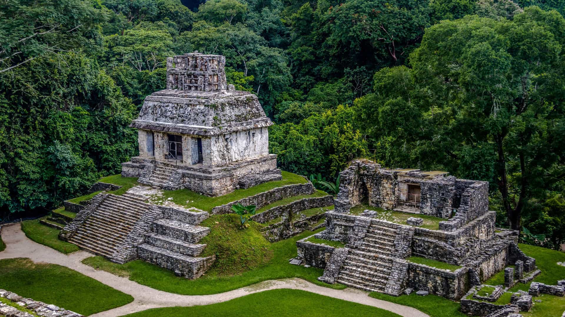 Ancient Mayan ruins of Palenque, Mexico, surrounded by lush jungle, a popular shore excursion for Royal Caribbean cruises.