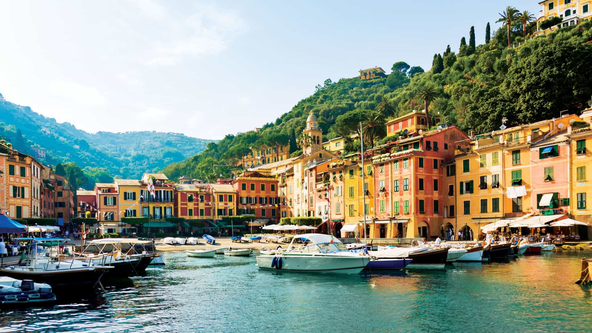 The picturesque harbor of Portofino, Italy, a vibrant and colorful destination in Europe along the Mediterranean Sea, and a featured port of call on a luxury Seabourn cruise.