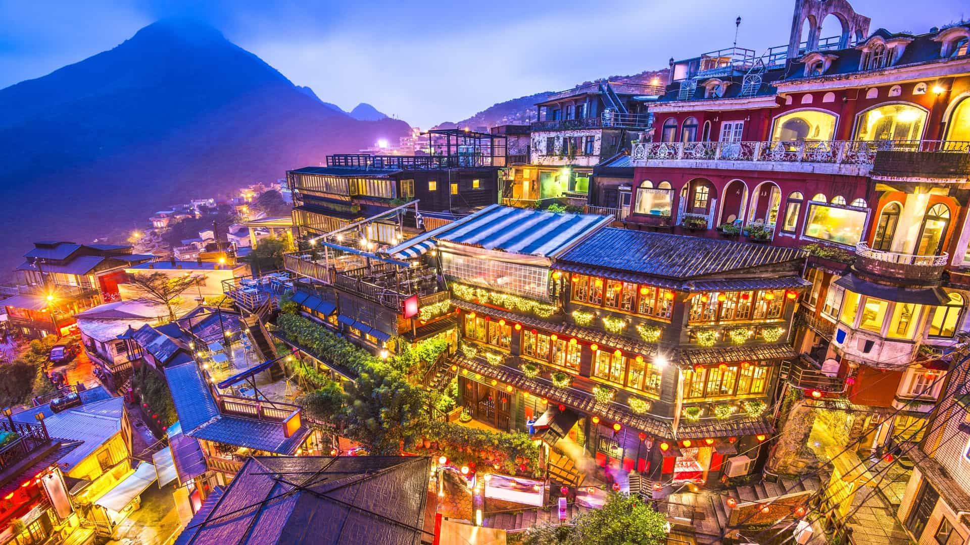 Jiufen Old Street in Taiwan glowing with lanterns at night.