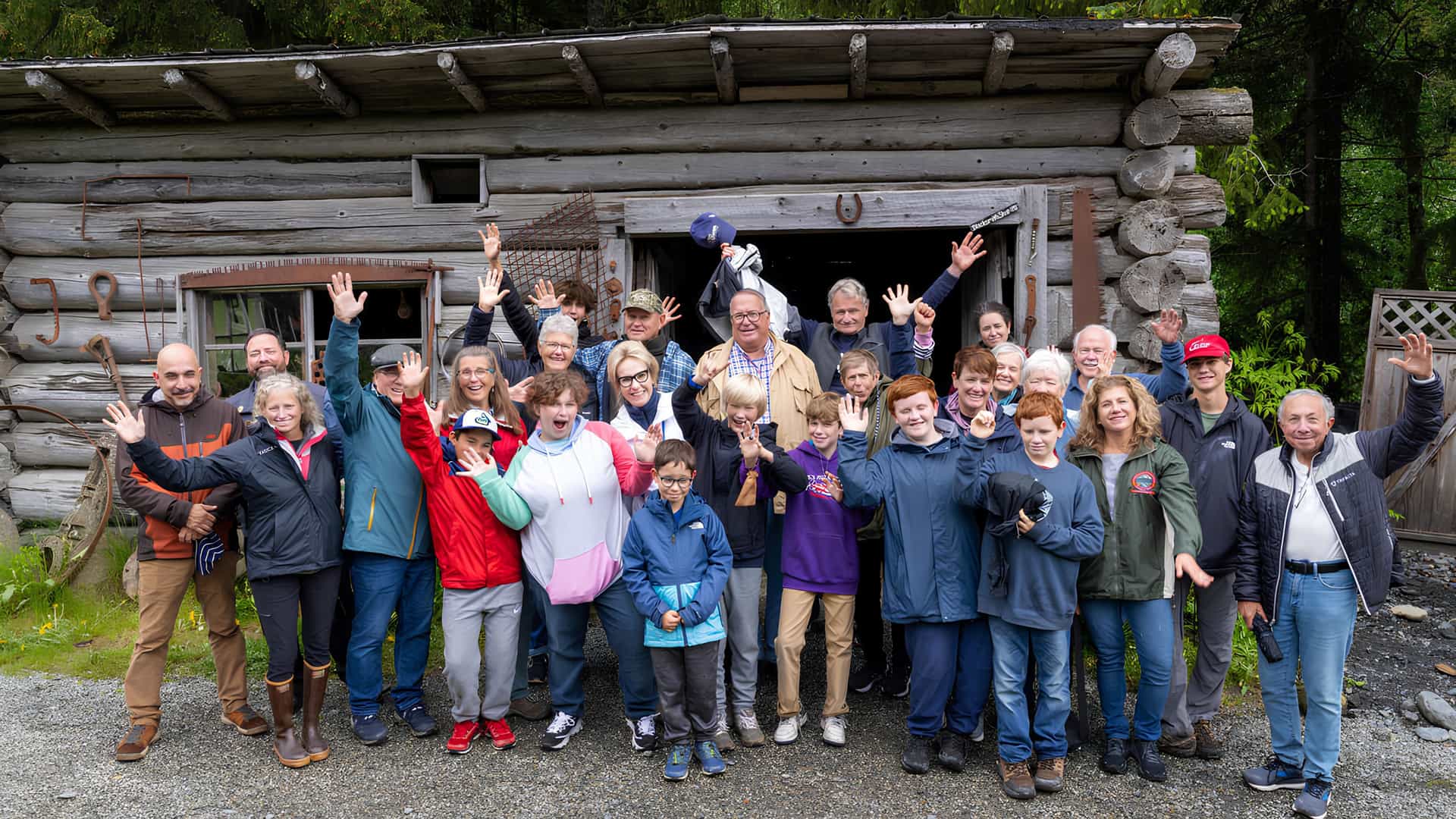 A large group photo of a tour group during a Tauck Bridges journey in Alaska.