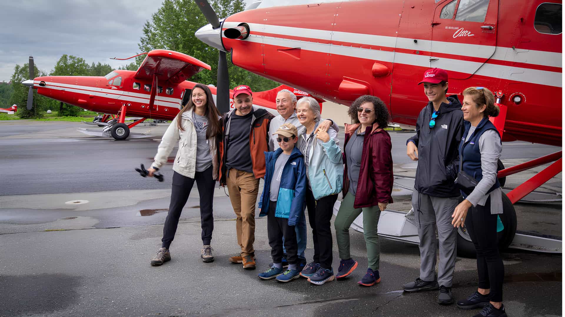 A family getting ready for a flight seeing excursion on a Tauck Bridges journey in Alaska.