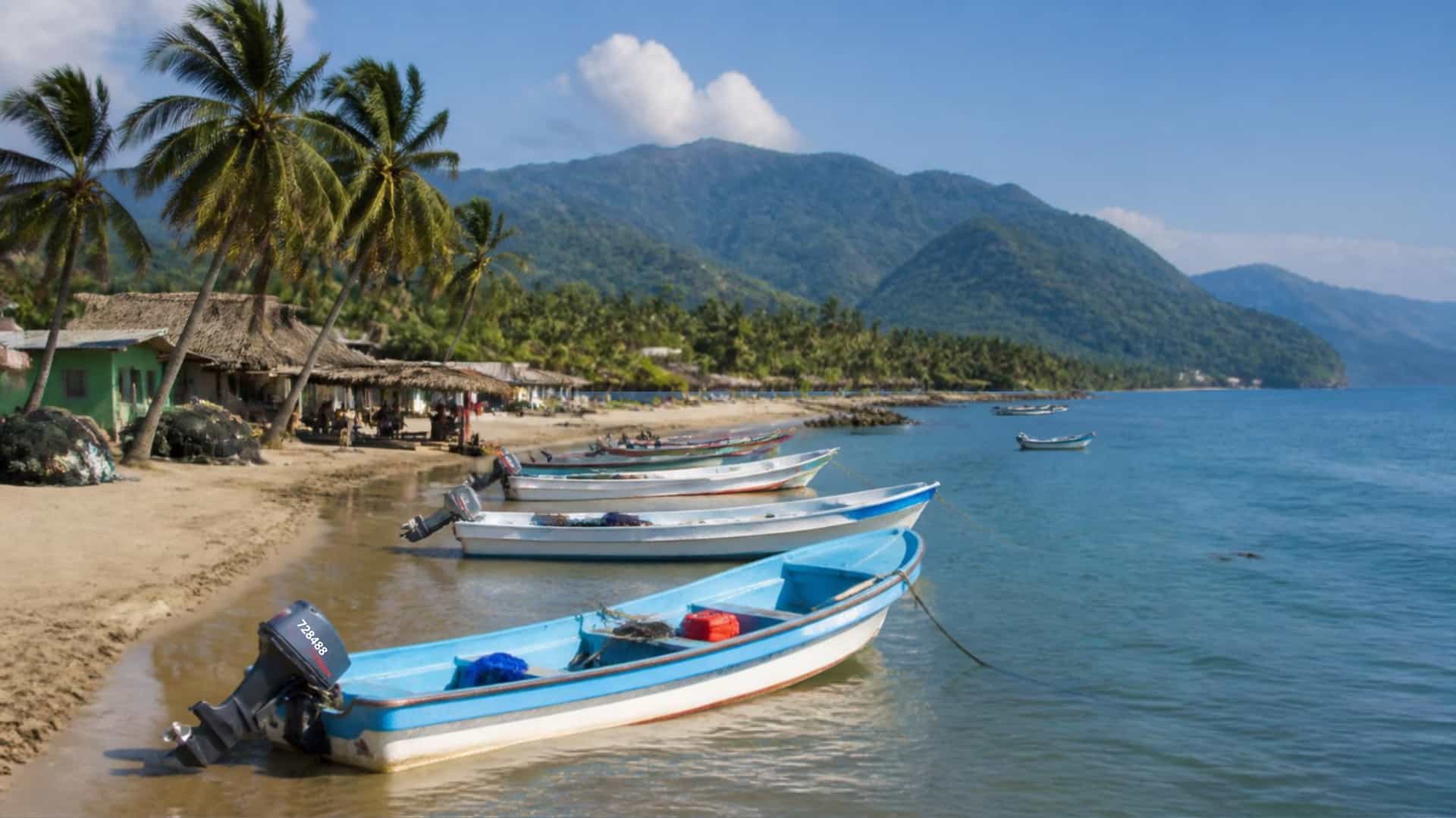 The tropical Pacific port town of Puerto Madero, Chiapas, Mexico, with palm beaches and fishing boats.