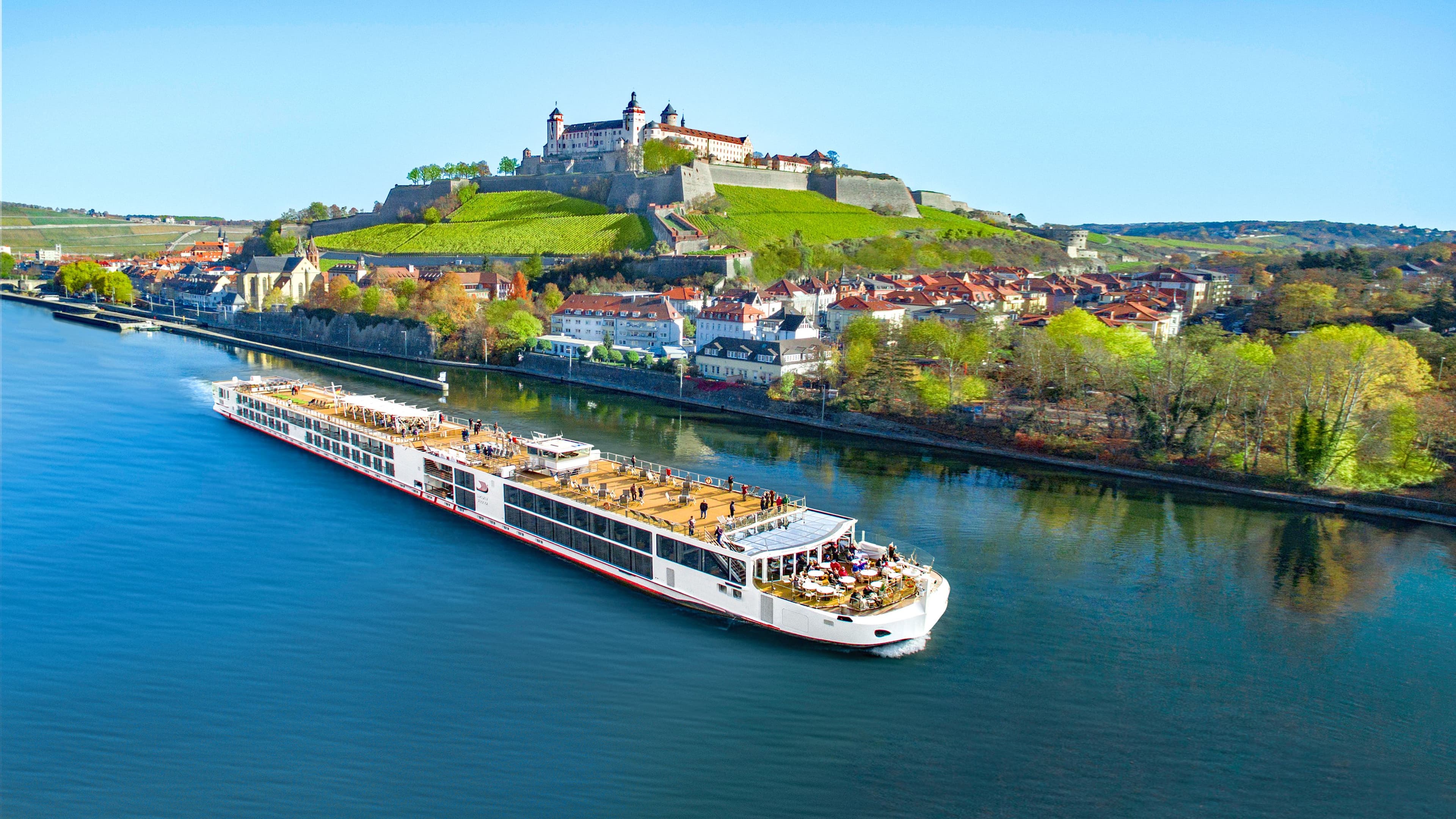 Viking Einar sailing with a castle behind it.
