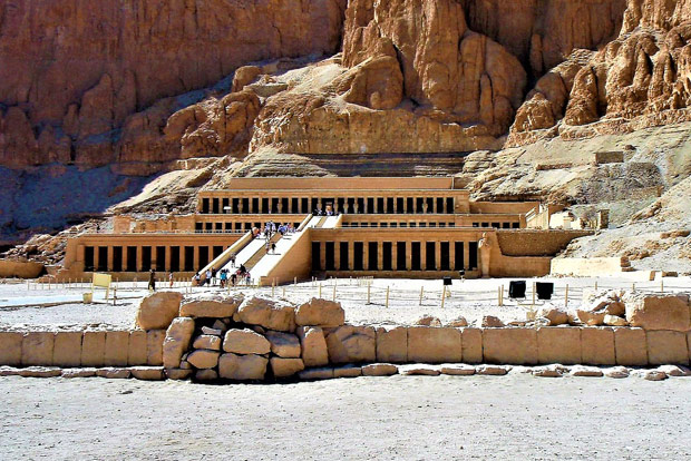 Tourists walk up to the temple of Hatshepsut in Luxor, Egypt.