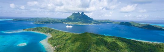 Picture of water, islands and a cruise ship in the distance
